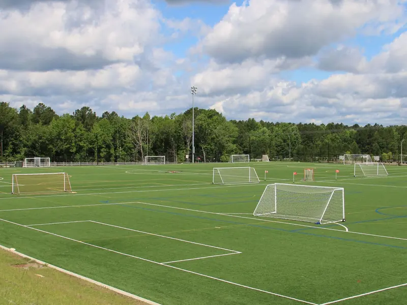 Synthetic turf fields laid out with soccer and lacrosse goals side by side.